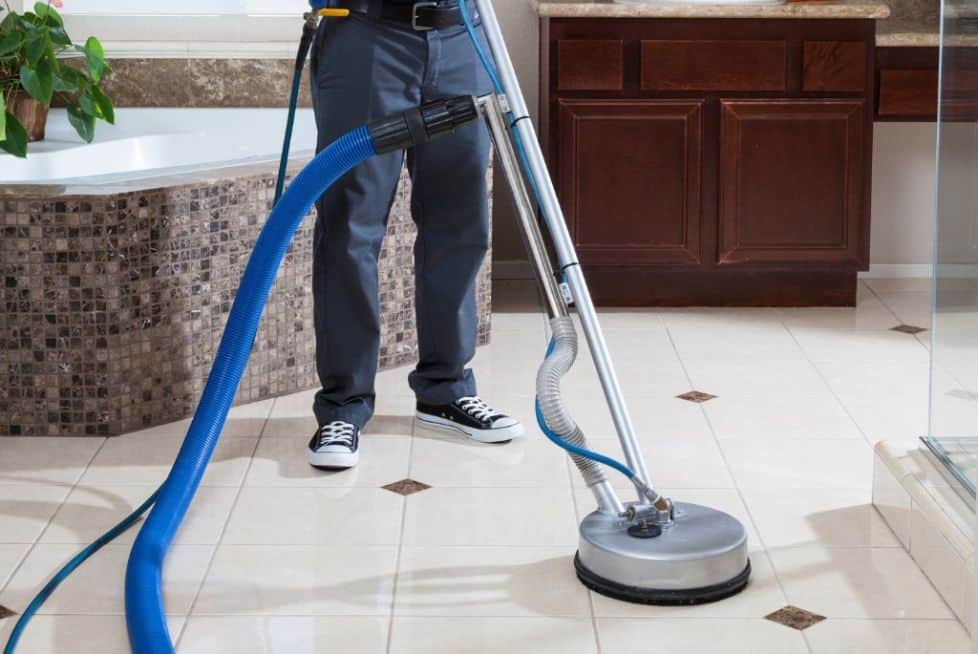 man cleaning the tiles